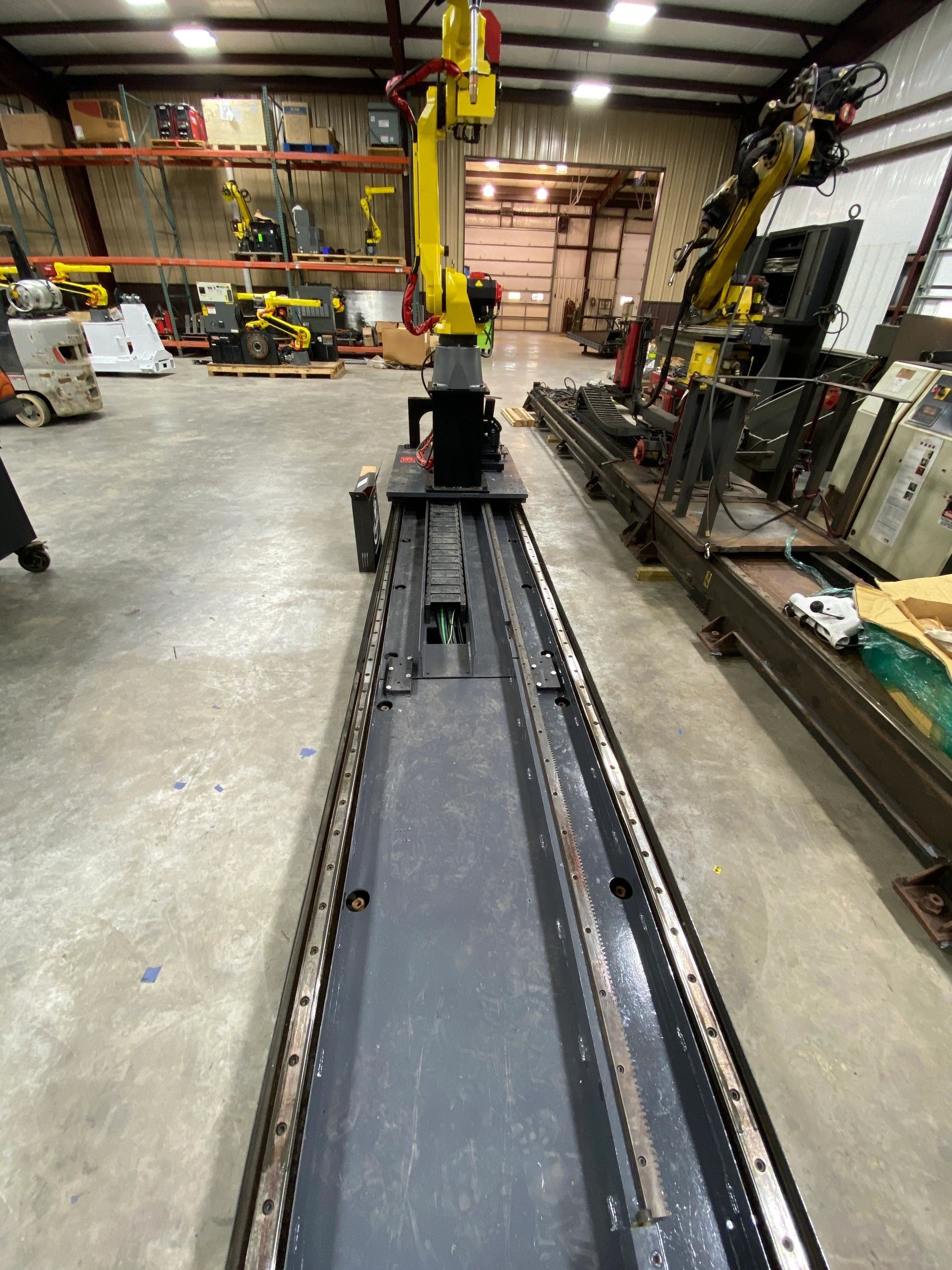 Welding robots and cells inside the Rice Automation shop